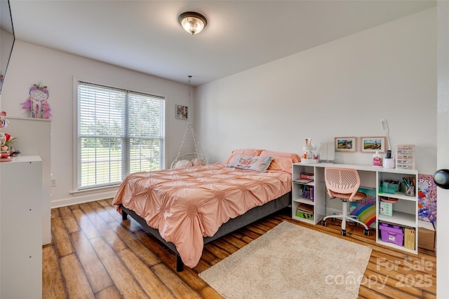1140 Landsdown Dr, Salisbury, NC 28147 - bedroom featuring wood finished floors and baseboards