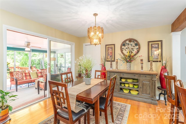 307 Tree Haven Blvd, Hendersonville, NC 28791 - dining room with light wood-style floors, a chandelier, and a ceiling fan