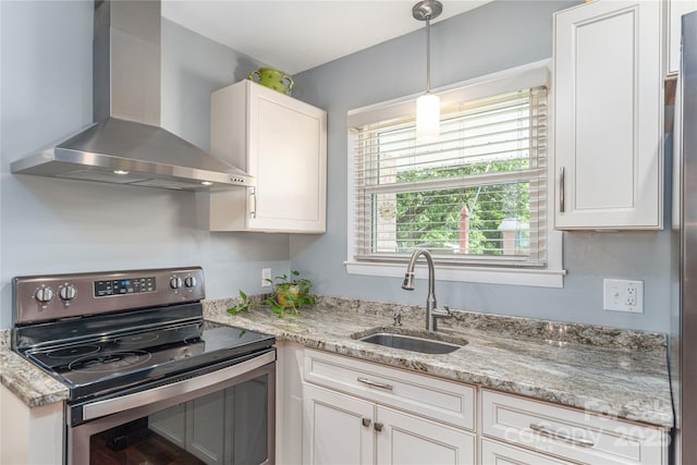 307 Tree Haven Blvd, Hendersonville, NC 28791 - kitchen featuring electric stove, wall chimney range hood, a sink, white cabinetry, and hanging light fixtures
