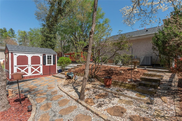 307 Tree Haven Blvd, Hendersonville, NC 28791 - view of patio / terrace with a storage unit, an outdoor structure, and central air condition unit