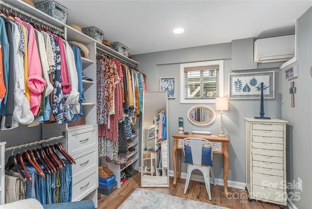 307 Tree Haven Blvd, Hendersonville, NC 28791 - walk in closet with a wall mounted air conditioner and wood finished floors