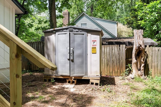 view of shed with fence