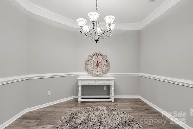 3820 Leela Palace Way, Fort Mill, SC 29708 - unfurnished dining area featuring a chandelier, ornamental molding, wood finished floors, and baseboards