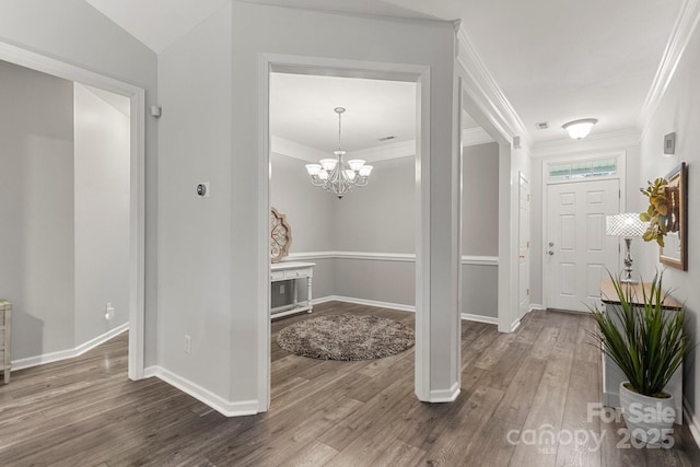 3820 Leela Palace Way, Fort Mill, SC 29708 - entrance foyer featuring wood finished floors, baseboards, crown molding, and a chandelier