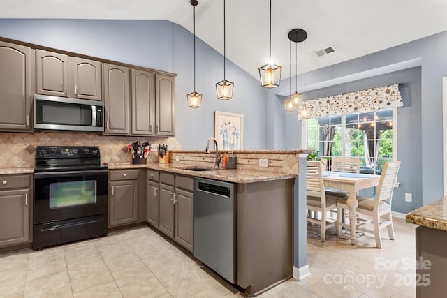 3820 Leela Palace Way, Fort Mill, SC 29708 - kitchen featuring stainless steel appliances, a sink, vaulted ceiling, gray cabinetry, and backsplash