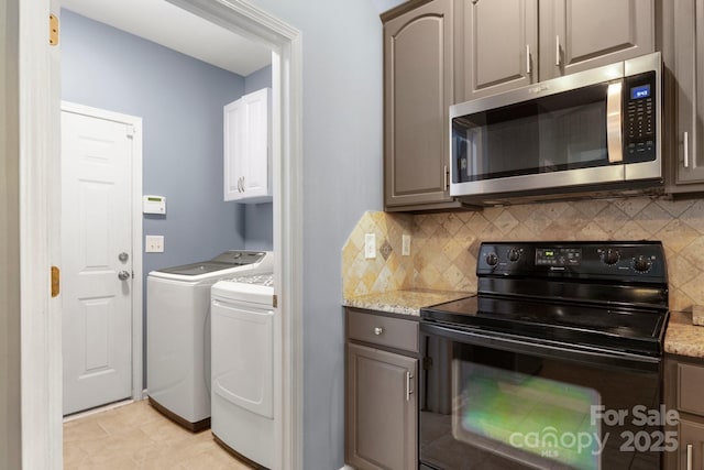 3820 Leela Palace Way, Fort Mill, SC 29708 - clothes washing area featuring washer and dryer and cabinet space