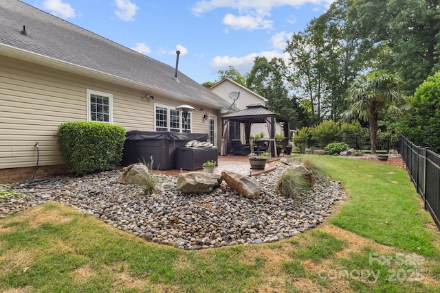3820 Leela Palace Way, Fort Mill, SC 29708 - back of house featuring a hot tub, a gazebo, a patio area, and a shingled roof