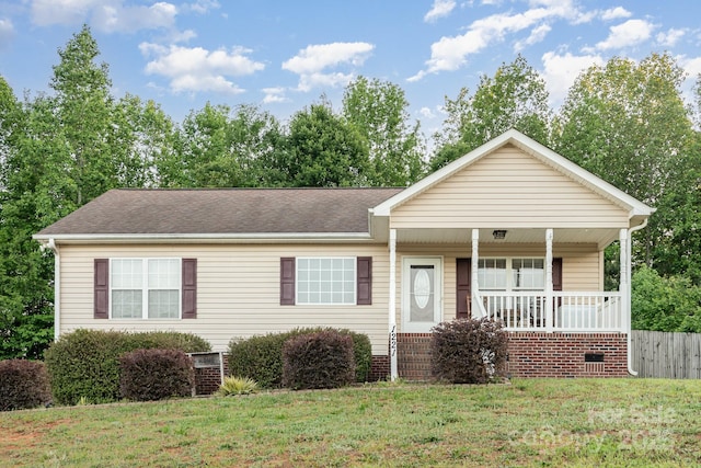 1221 Woodpecker Dr, Clover, SC 29710 - view of front of house featuring a porch, a front lawn, and roof with shingles