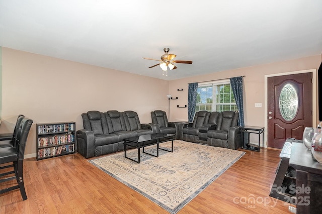 1221 Woodpecker Dr, Clover, SC 29710 - living room featuring a ceiling fan, light wood-style floors, and baseboards