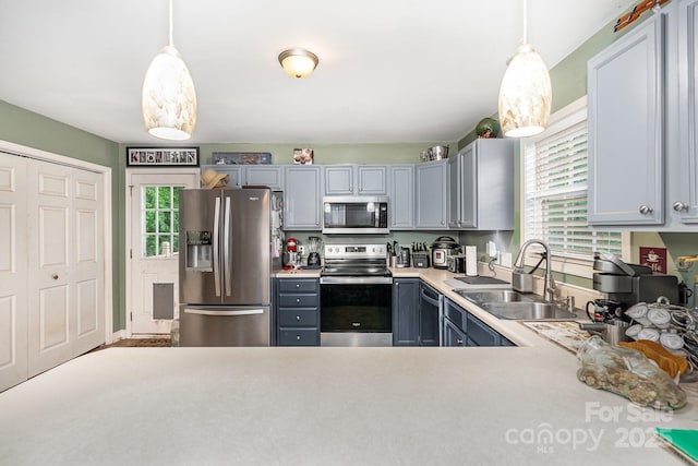 1221 Woodpecker Dr, Clover, SC 29710 - kitchen with stainless steel appliances, a sink, light countertops, and plenty of natural light