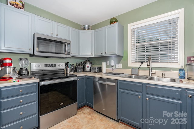 1221 Woodpecker Dr, Clover, SC 29710 - kitchen with stainless steel appliances, a sink, and light countertops