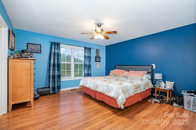1221 Woodpecker Dr, Clover, SC 29710 - bedroom featuring wood finished floors, baseboards, and ceiling fan