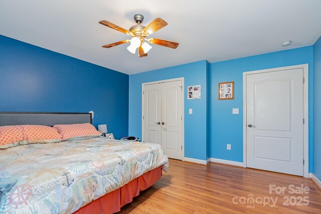 1221 Woodpecker Dr, Clover, SC 29710 - bedroom with light wood-style floors, baseboards, a closet, and ceiling fan