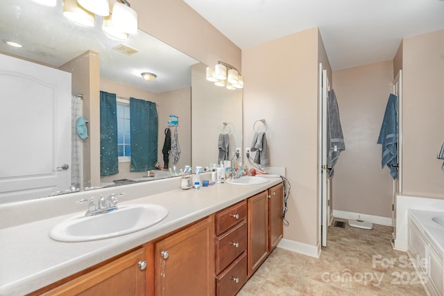 1221 Woodpecker Dr, Clover, SC 29710 - full bathroom with double vanity, a tub, and baseboards