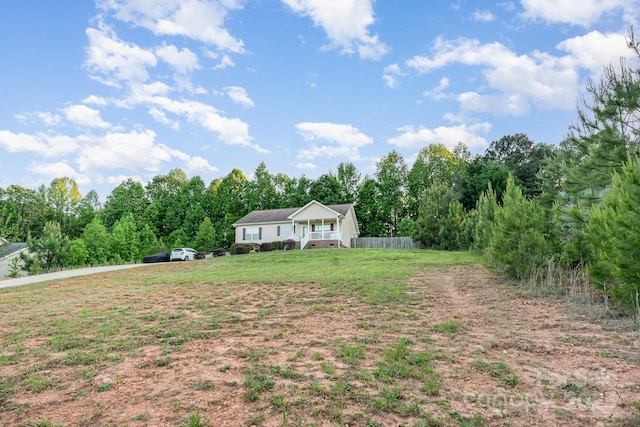 1221 Woodpecker Dr, Clover, SC 29710 - view of grassy yard with a wooded view