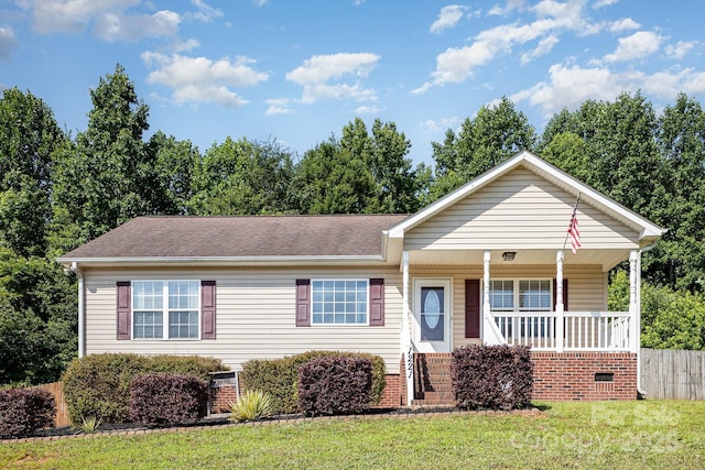 1221 Woodpecker Dr, Clover, SC 29710 - view of front facade with covered porch, a front yard, and a shingled roof