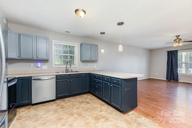 1221 Woodpecker Dr, Clover, SC 29710 - kitchen featuring dishwasher, a peninsula, range with electric cooktop, light countertops, and ceiling fan