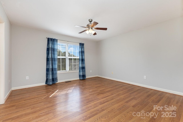 1221 Woodpecker Dr, Clover, SC 29710 - empty room featuring ceiling fan and wood finished floors