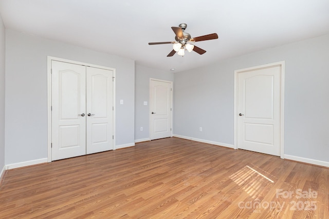 1221 Woodpecker Dr, Clover, SC 29710 - unfurnished bedroom featuring light wood-type flooring, a ceiling fan, and a closet