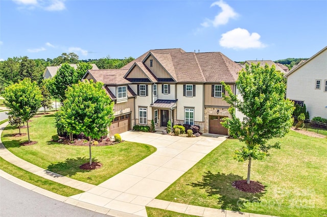 13204 Feale Ct, Charlotte, NC 28278 - view of front facade featuring an attached garage, driveway, board and batten siding, and stone siding