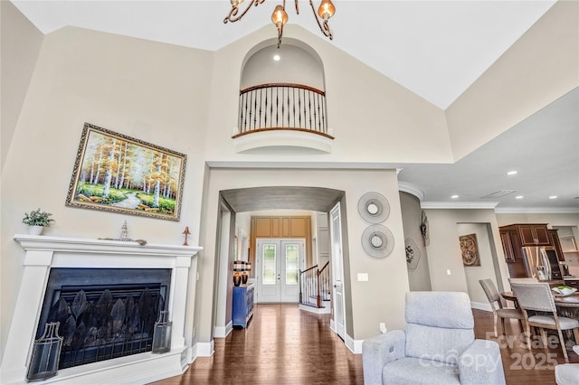 13204 Feale Ct, Charlotte, NC 28278 - living area with dark wood-style flooring, baseboards, recessed lighting, french doors, and a fireplace with raised hearth