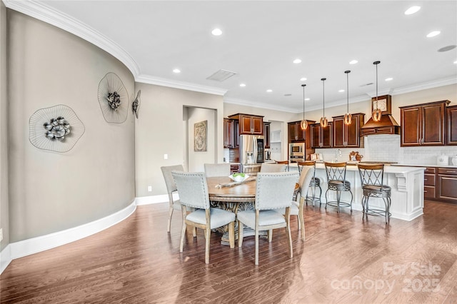 13204 Feale Ct, Charlotte, NC 28278 - dining area featuring recessed lighting, dark wood-style flooring, ornamental molding, and baseboards