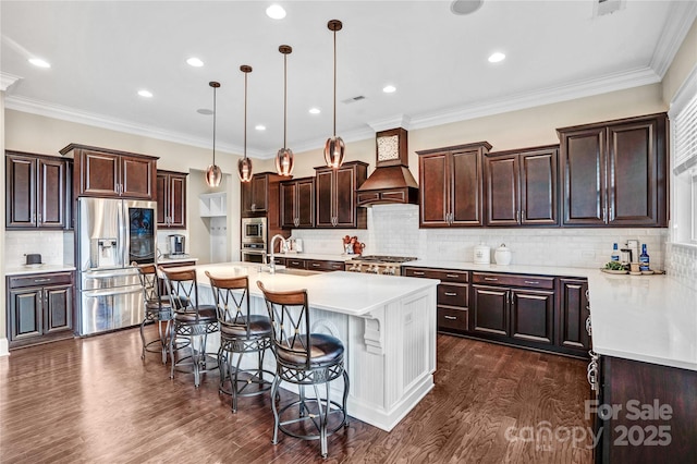13204 Feale Ct, Charlotte, NC 28278 - kitchen featuring appliances with stainless steel finishes, custom exhaust hood, a breakfast bar, decorative backsplash, and dark brown cabinetry