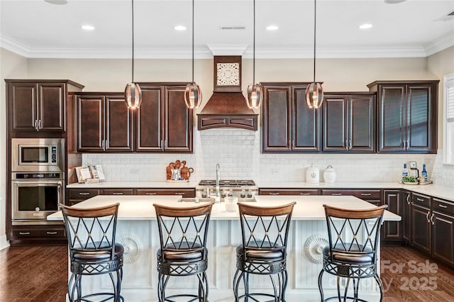 13204 Feale Ct, Charlotte, NC 28278 - kitchen with appliances with stainless steel finishes, light countertops, dark wood-style floors, crown molding, and recessed lighting