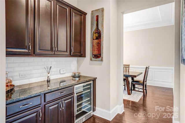 13204 Feale Ct, Charlotte, NC 28278 - bar featuring wine cooler, dark wood-style flooring, tasteful backsplash, ornamental molding, and baseboards