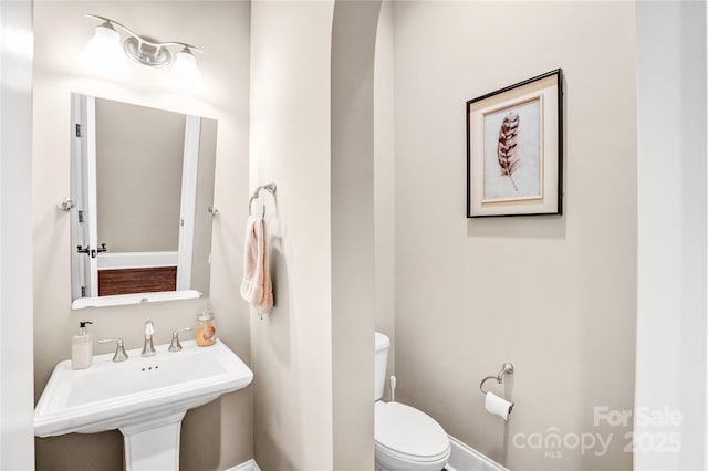 13204 Feale Ct, Charlotte, NC 28278 - half bathroom featuring toilet and a sink