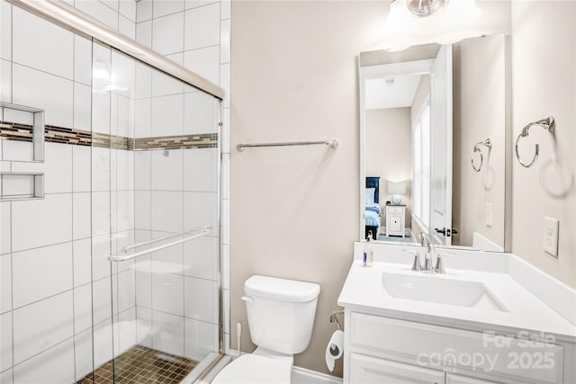 13204 Feale Ct, Charlotte, NC 28278 - ensuite bathroom featuring a shower stall, toilet, and vanity