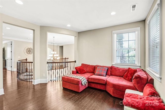 13204 Feale Ct, Charlotte, NC 28278 - living area with a chandelier, dark wood-style flooring, recessed lighting, ornamental molding, and baseboards