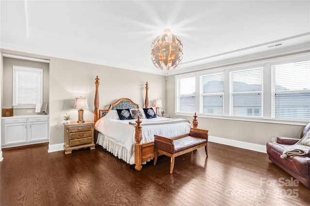 13204 Feale Ct, Charlotte, NC 28278 - bedroom featuring a chandelier, dark wood-style flooring, baseboards, and crown molding