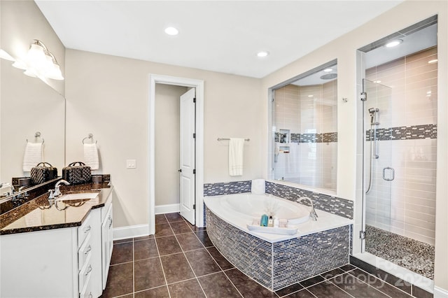 13204 Feale Ct, Charlotte, NC 28278 - full bathroom with a bath, a shower stall, tile patterned flooring, vanity, and baseboards