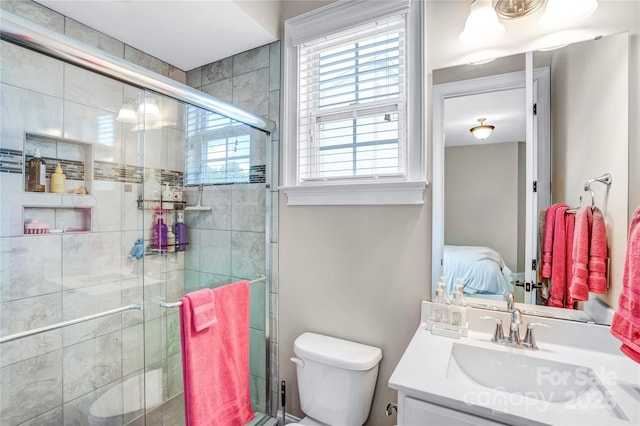 13204 Feale Ct, Charlotte, NC 28278 - bathroom with vanity, a shower stall, and toilet