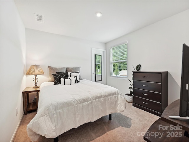 bedroom featuring carpet flooring and baseboards