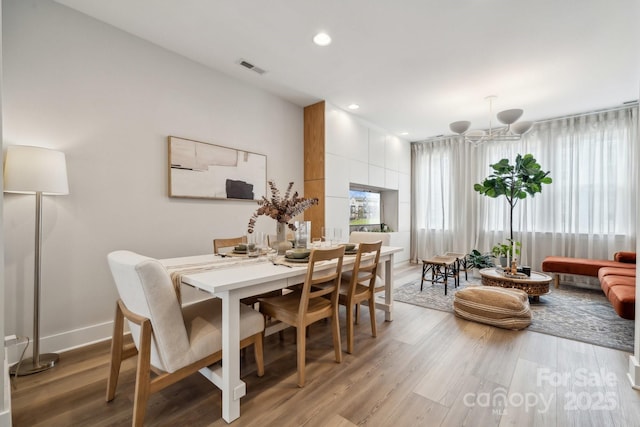 dining space featuring light wood-style floors, recessed lighting, and baseboards