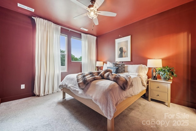 bedroom with carpet, baseboards, and ceiling fan