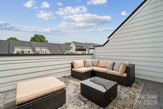 view of patio featuring a balcony and outdoor lounge area