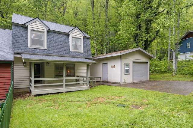 5 Creekside Dr, Maggie Valley, NC 28751 - view of front of property with a shingled roof, an outdoor structure, driveway, a porch, and a front yard