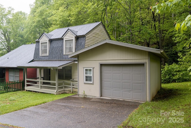 5 Creekside Dr, Maggie Valley, NC 28751 - view of front of house with roof with shingles, driveway, a porch, and an attached garage