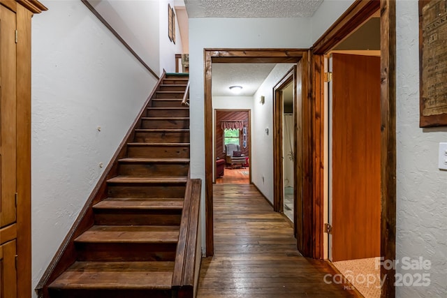 5 Creekside Dr, Maggie Valley, NC 28751 - stairs with a textured ceiling, wood-type flooring, and a textured wall