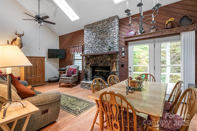 5 Creekside Dr, Maggie Valley, NC 28751 - dining space featuring high vaulted ceiling, a ceiling fan, wooden walls, a skylight, and light wood-style floors