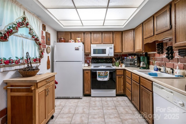 5 Creekside Dr, Maggie Valley, NC 28751 - kitchen with white appliances, a sink, brown cabinets, and light tile patterned floors
