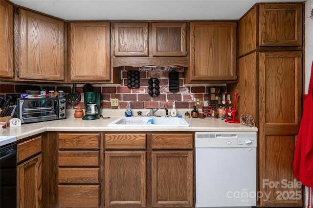 5 Creekside Dr, Maggie Valley, NC 28751 - kitchen featuring white dishwasher, a sink, brown cabinetry, and light countertops