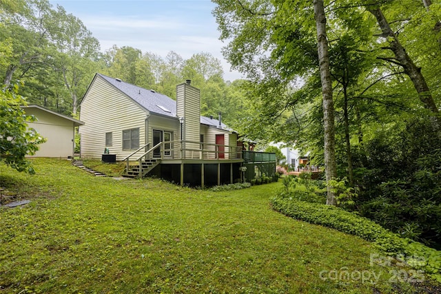 5 Creekside Dr, Maggie Valley, NC 28751 - rear view of property featuring a chimney, a lawn, and a deck