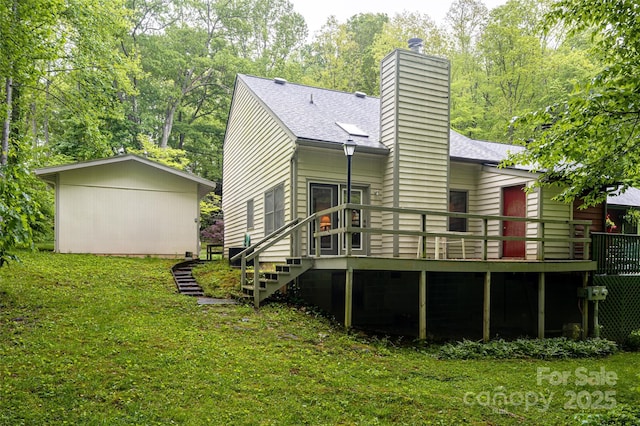 5 Creekside Dr, Maggie Valley, NC 28751 - rear view of house with a wooden deck, a yard, roof with shingles, a chimney, and stairway