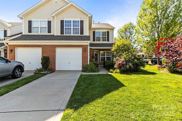 view of front of house featuring brick siding, a front lawn, driveway, and an attached garage