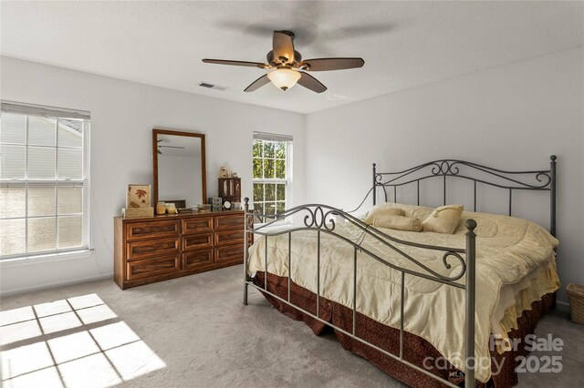 bedroom featuring carpet flooring and a ceiling fan