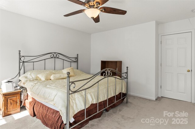 carpeted bedroom with a ceiling fan